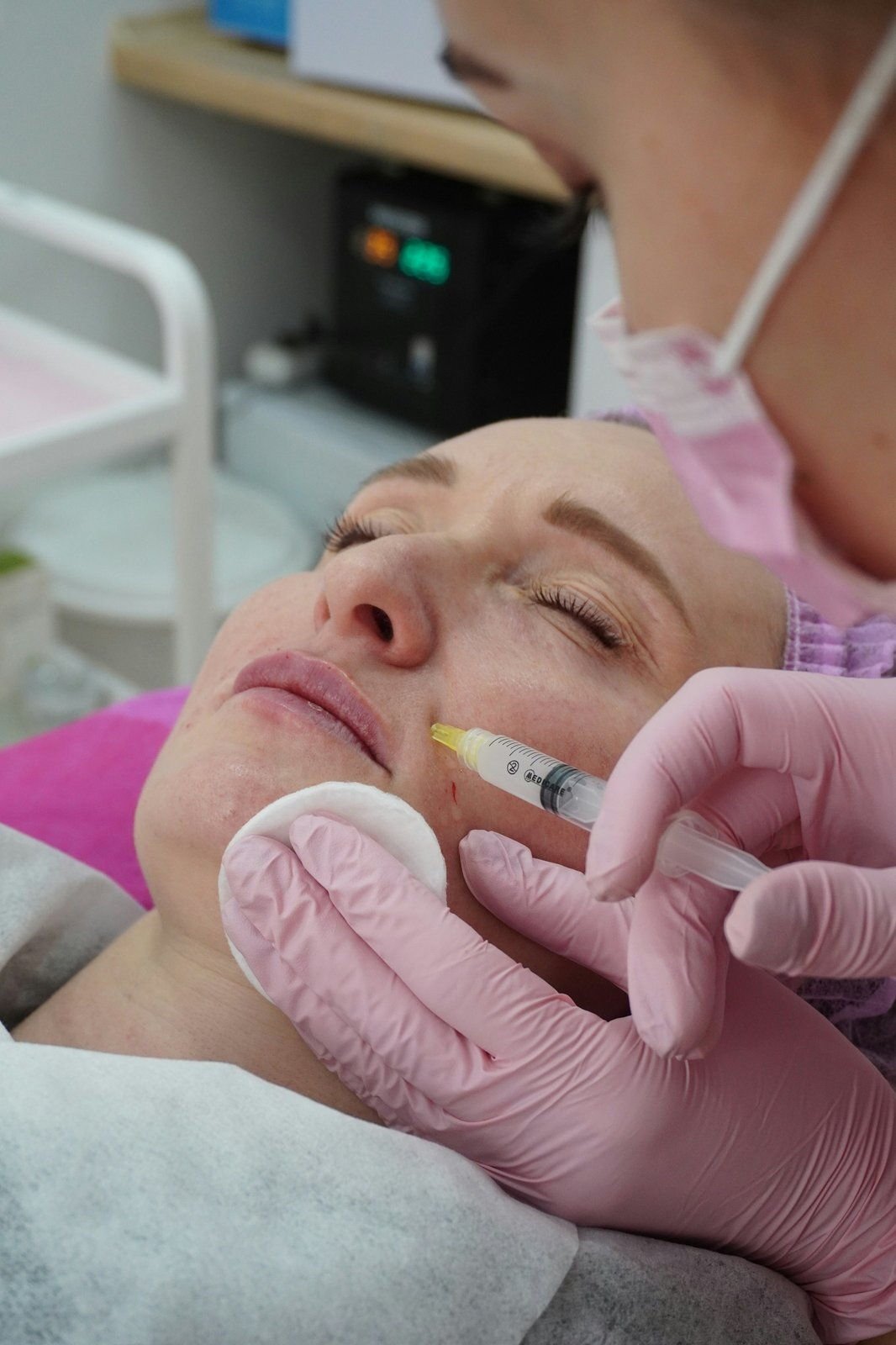 Skin specialist providing a close-up facial treatment