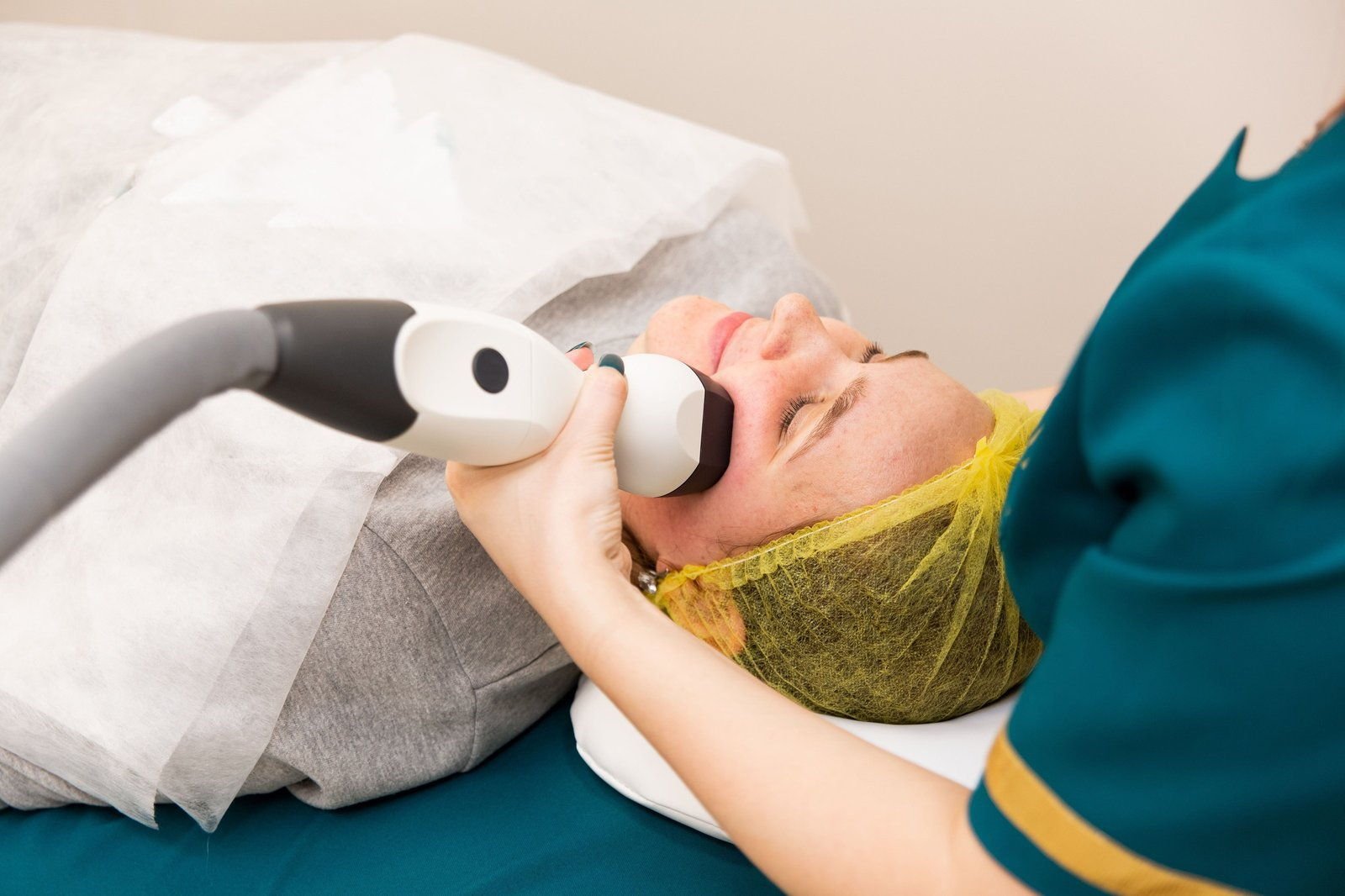 Patient receiving a laser treatment on the face (sample photo)