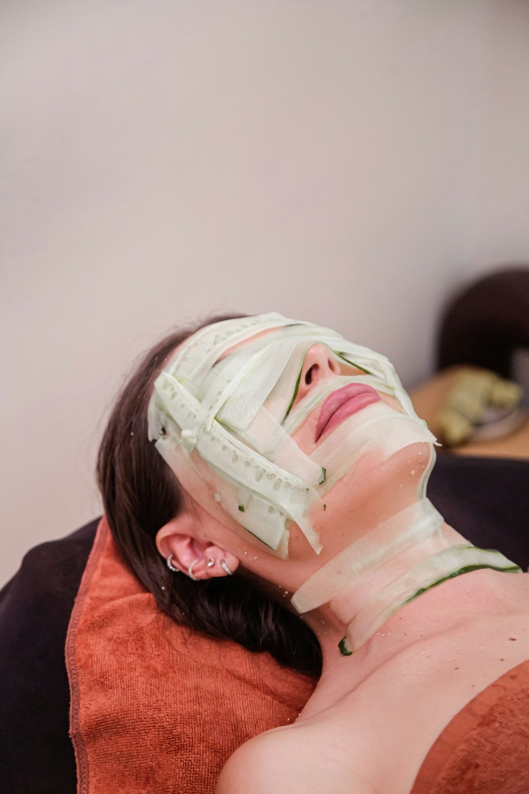 Patient relaxing during a facial skincare treatment